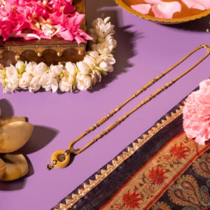 Gold teardrop mangalsutra with black bead flower detailing