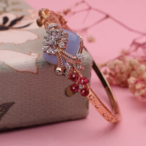 Rose gold bracelet with lavender cushion stone, diamond floral spray and red bead vine
