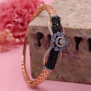 Rose gold jali bracelet with black stone panels and diamond floral centre