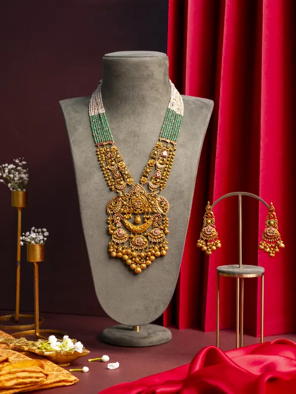 Gold temple haar with emerald strings and earrings